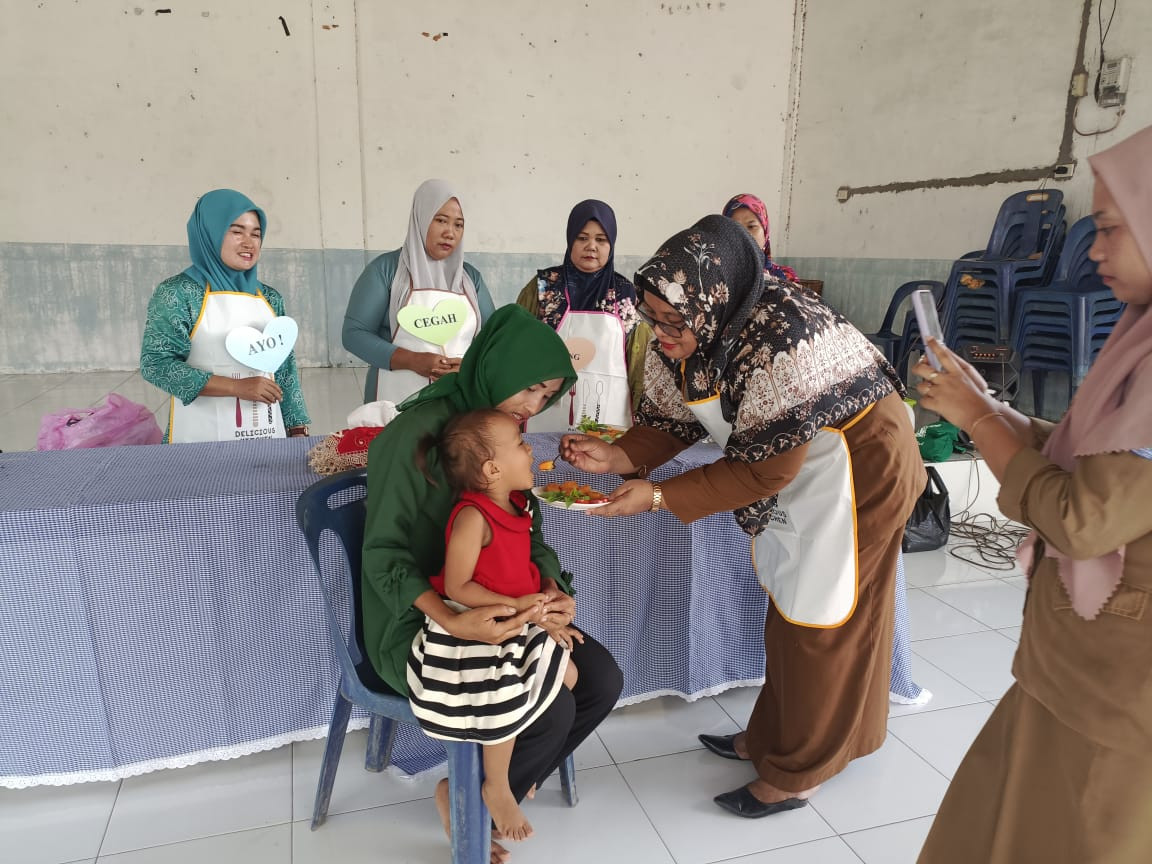 Mengikuti lomba DAHSYAT di Kampung Keluarga Berkualitas desa Denai Kuala