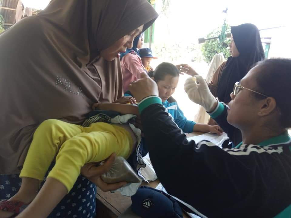 Melaksanakan Kegiatan posyandu sekaligus POS PIN (Pekan Imunisasi Nasional) tetes polio Desa Pematang Ganjang