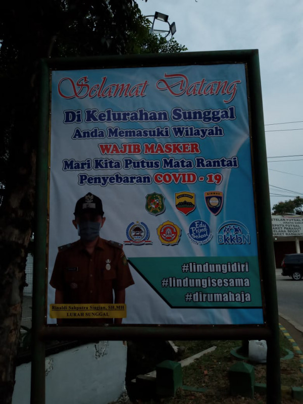 Spanduk Wajib masker di kelurahan Kampung KB Sunggal