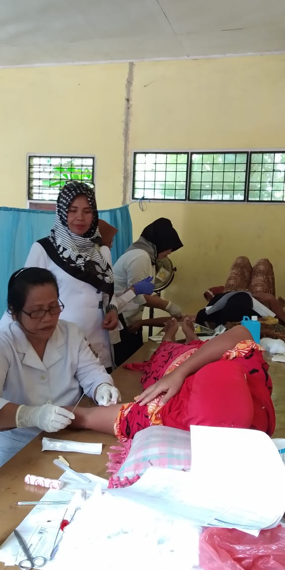 Pemasangan oleh koordinator bidan kecamatan perhentian raja