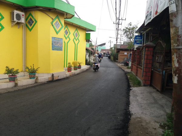 Pengaspalan Jalan Kampung KB Kampung Baiman